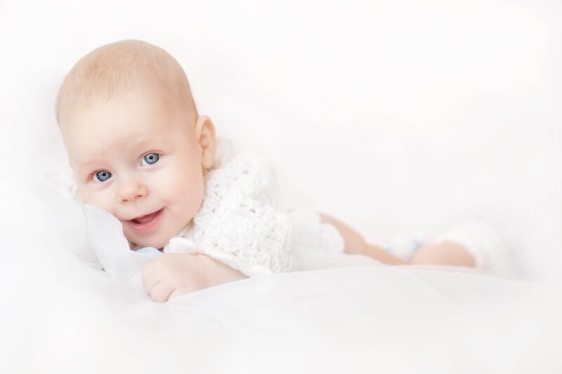 Baby Lying on White