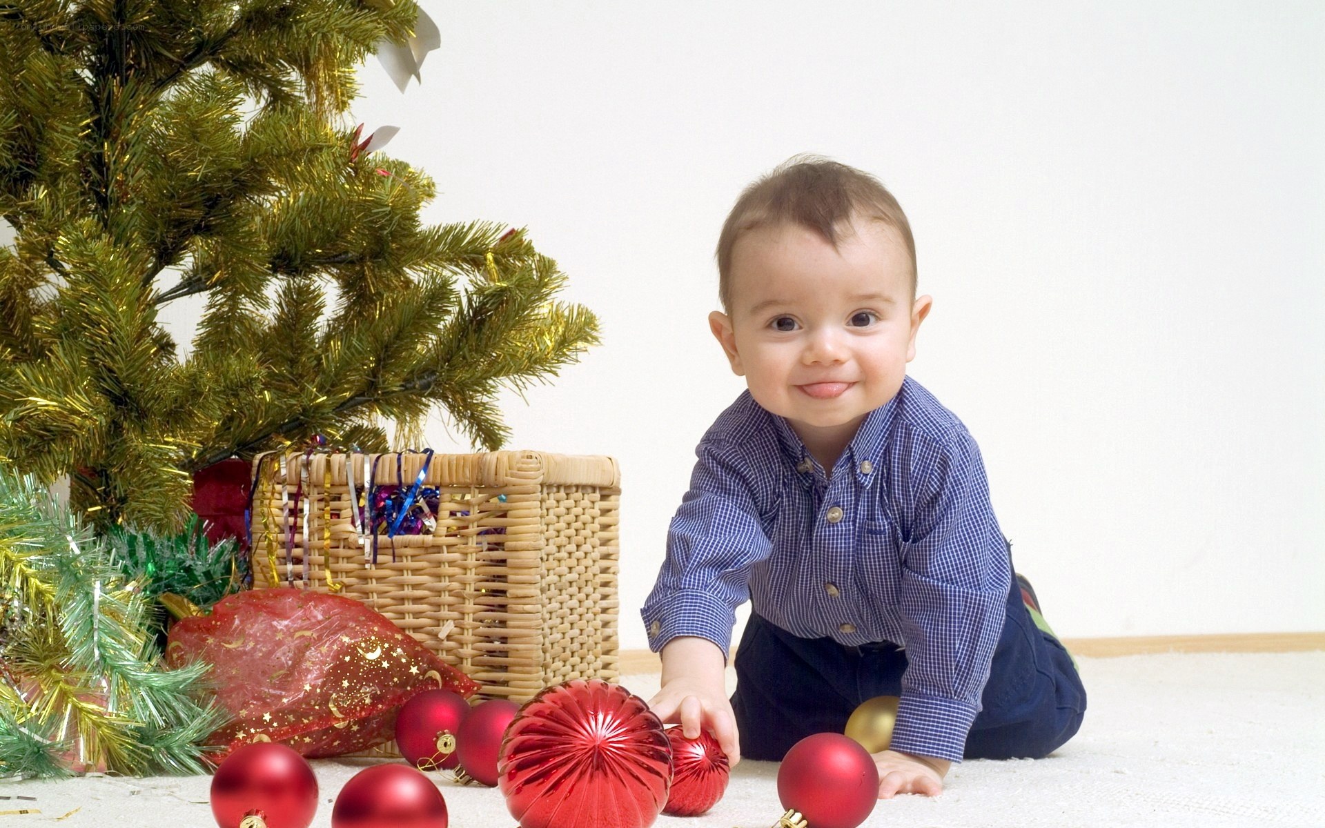 Baby near Christmas tree