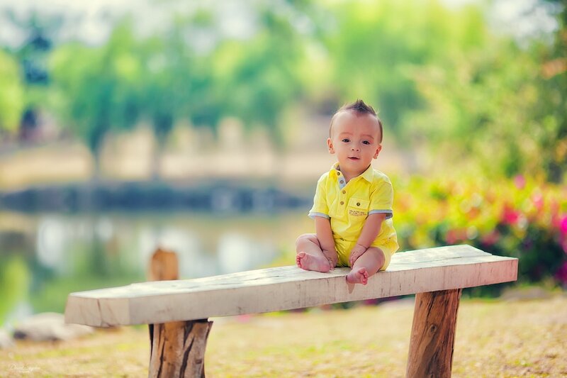 Baby on a wooden bench
