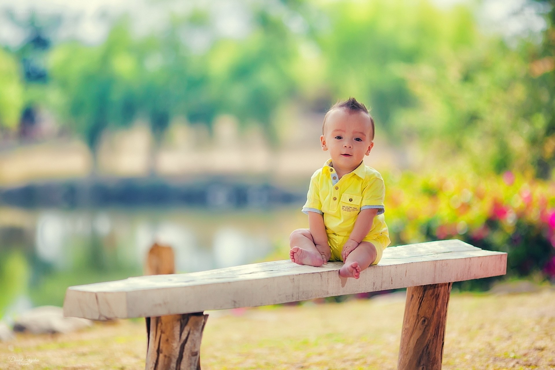 Baby on a wooden bench