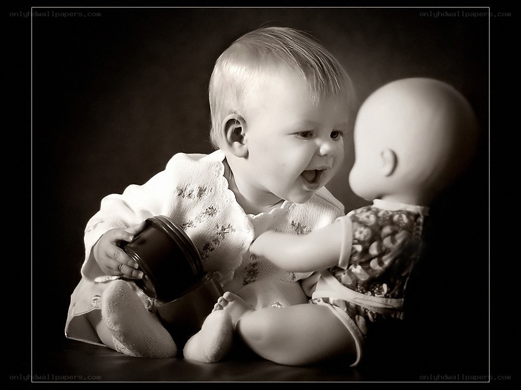 Baby playing with a doll