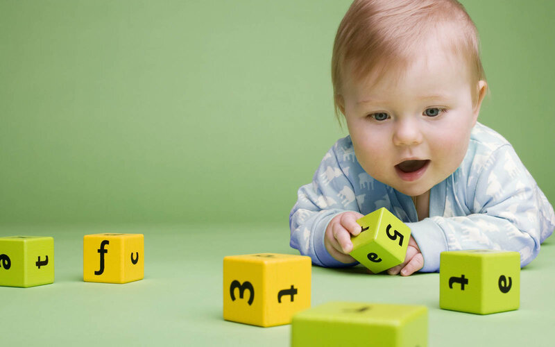 Baby Playing with Blocks