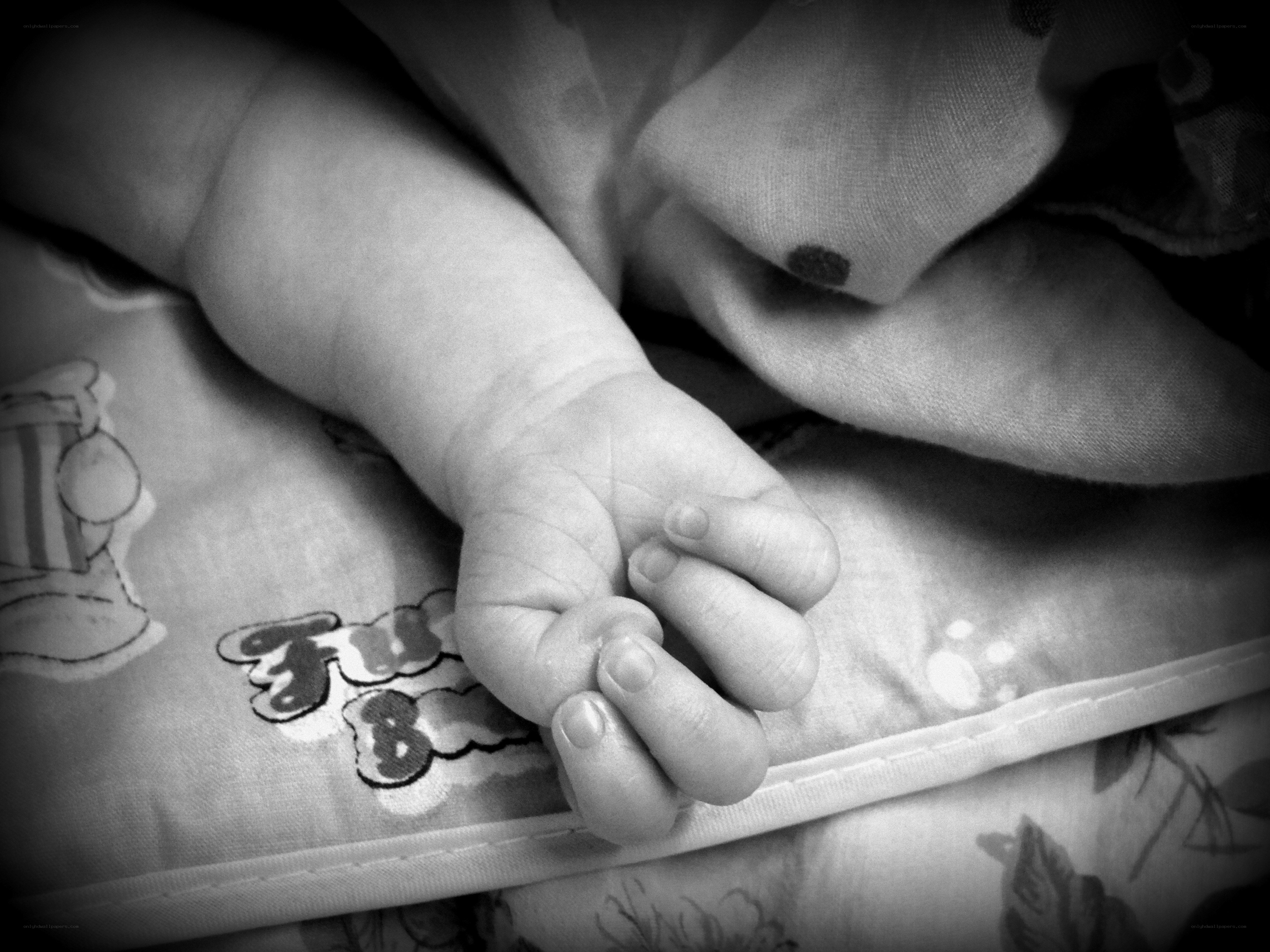Baby's hand on blanket