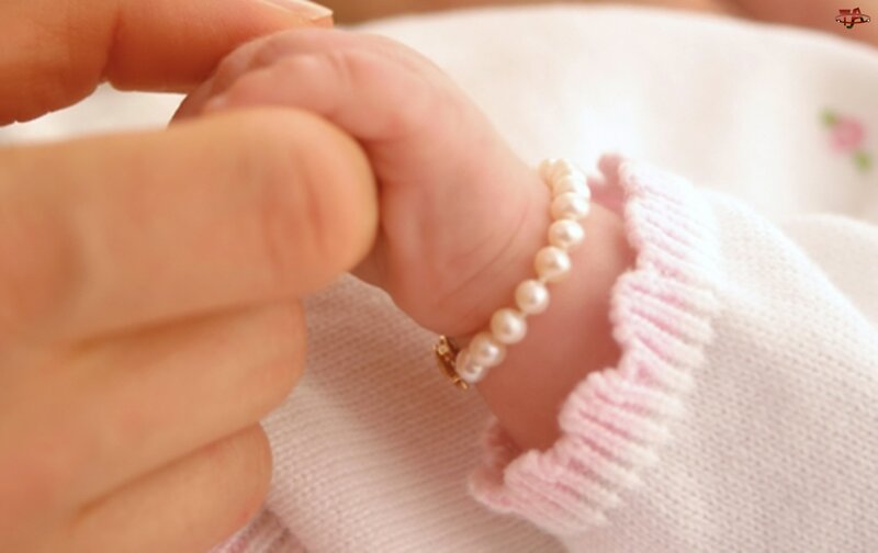 Baby's Hand with Pearl Bracelet