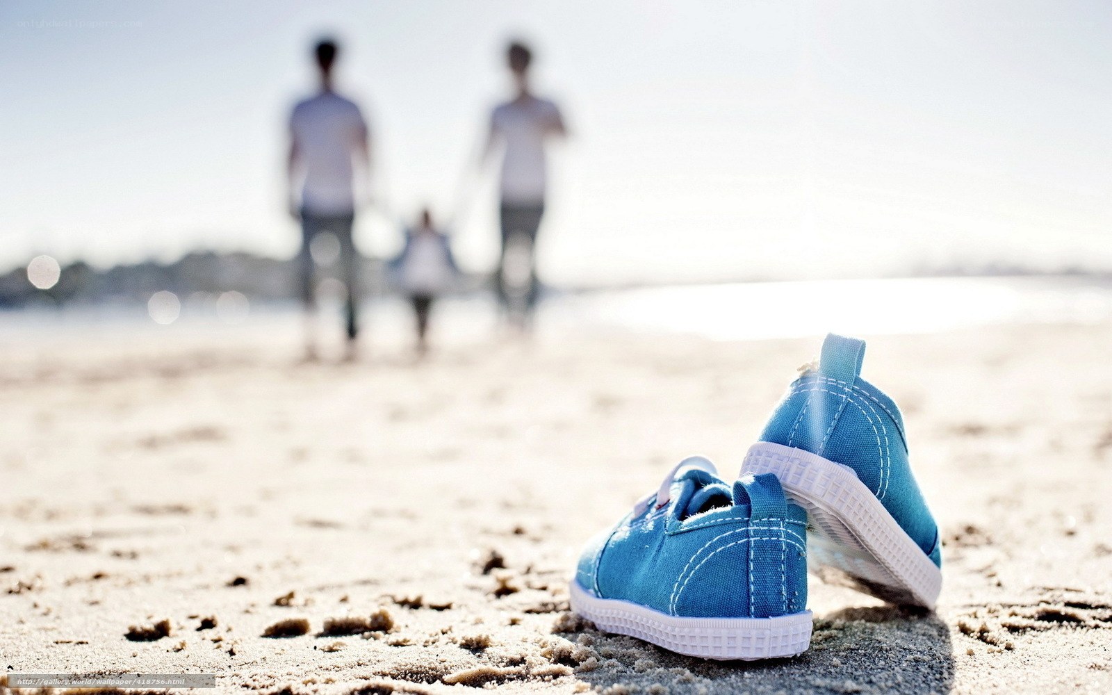 Baby shoes on the beach