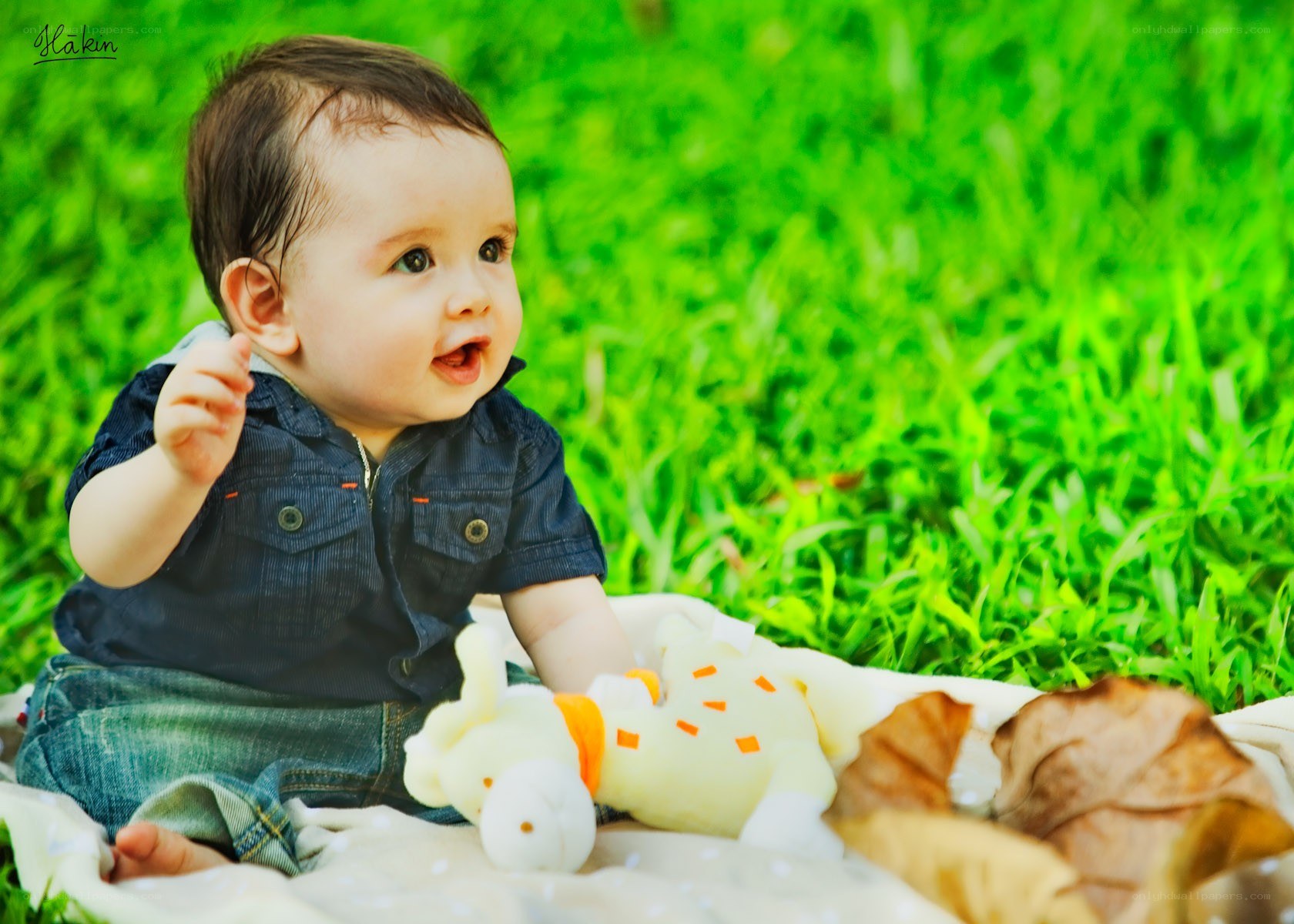 Baby sitting on grass