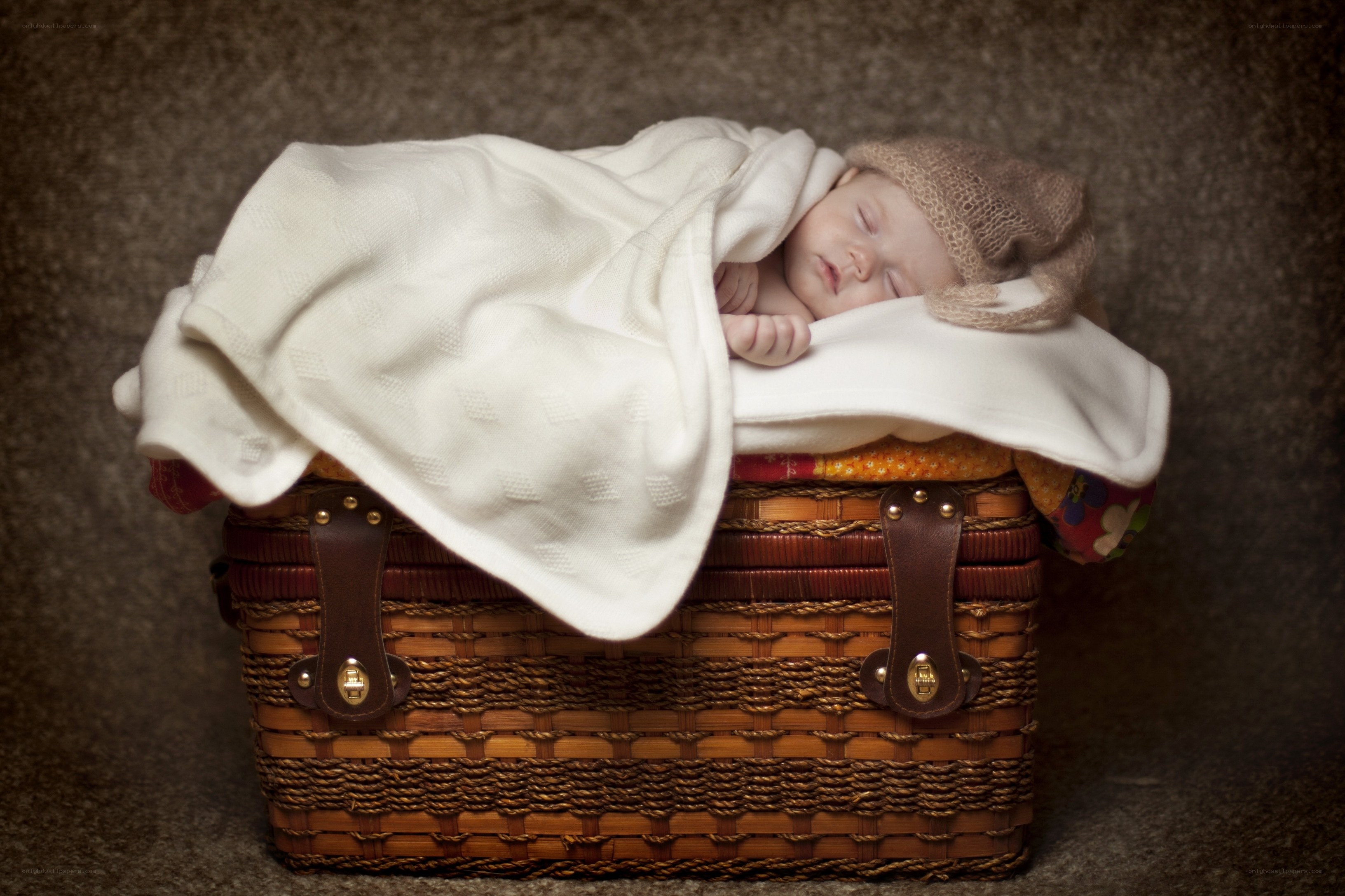 Baby sleeping in a basket