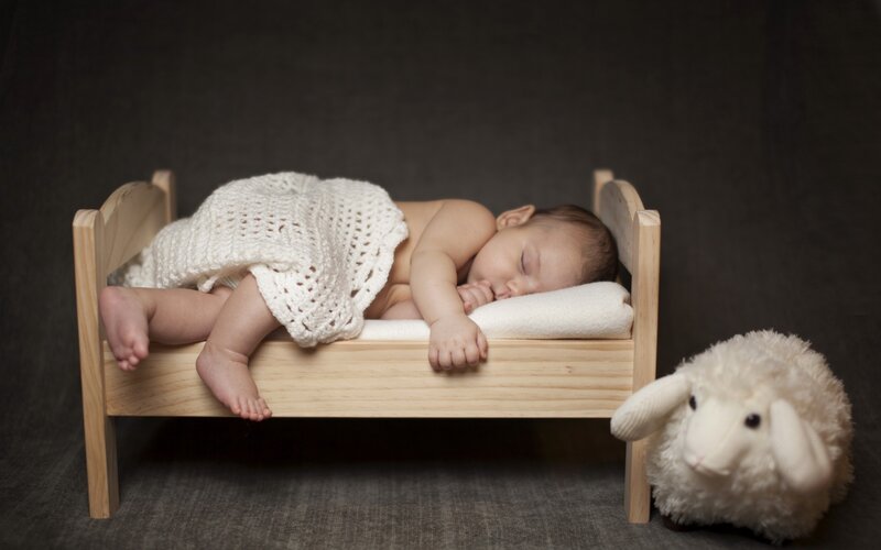Baby Sleeping in Bed — White, Serene