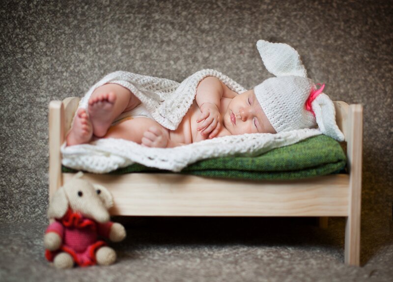 Baby Sleeping in Bed — White