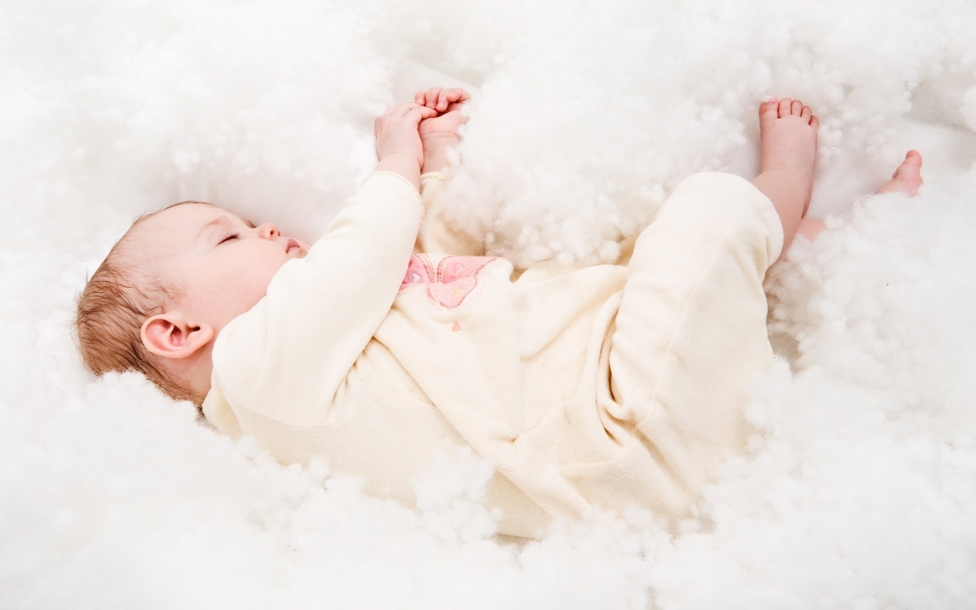 Baby sleeping in cotton fluff