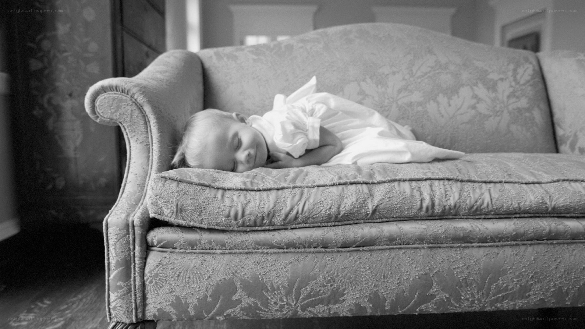 Baby sleeping on a couch