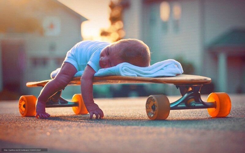 Baby sleeping on skateboard