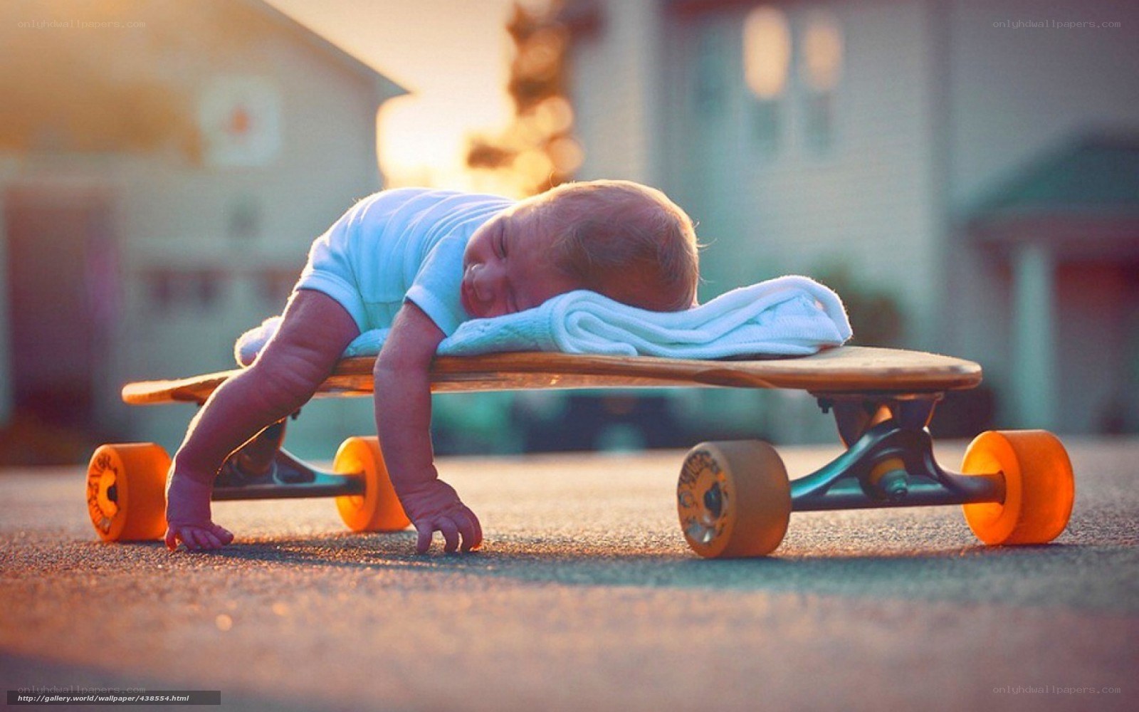 Baby sleeping on skateboard
