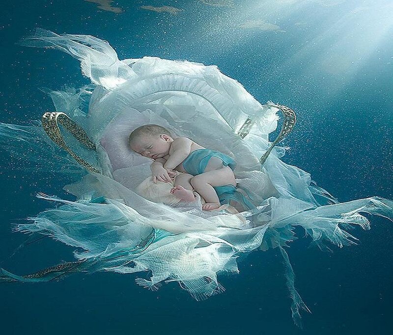 Baby sleeping underwater in a basket