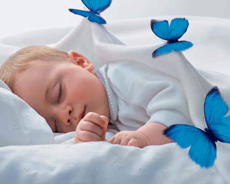 Baby sleeping with blue butterflies