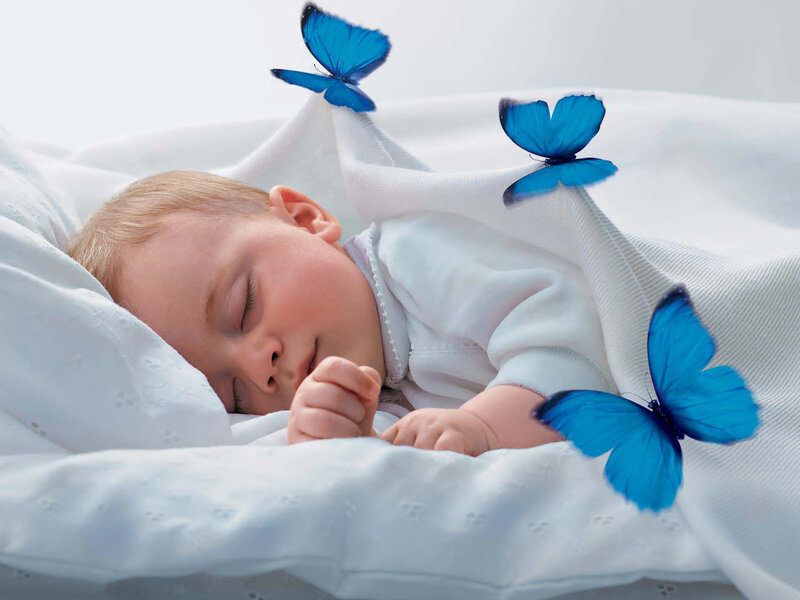 Baby sleeping with blue butterflies