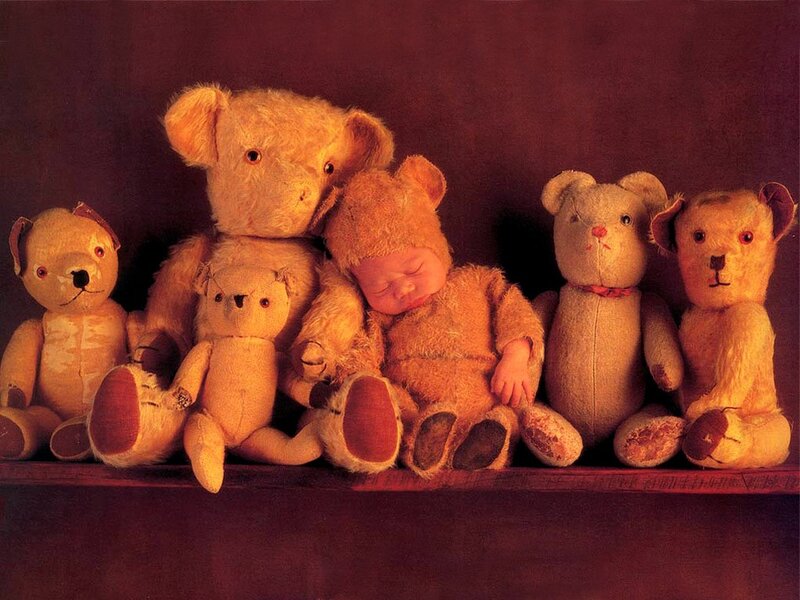 Baby sleeping with teddy bears