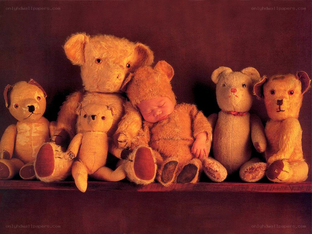 Baby sleeping with teddy bears