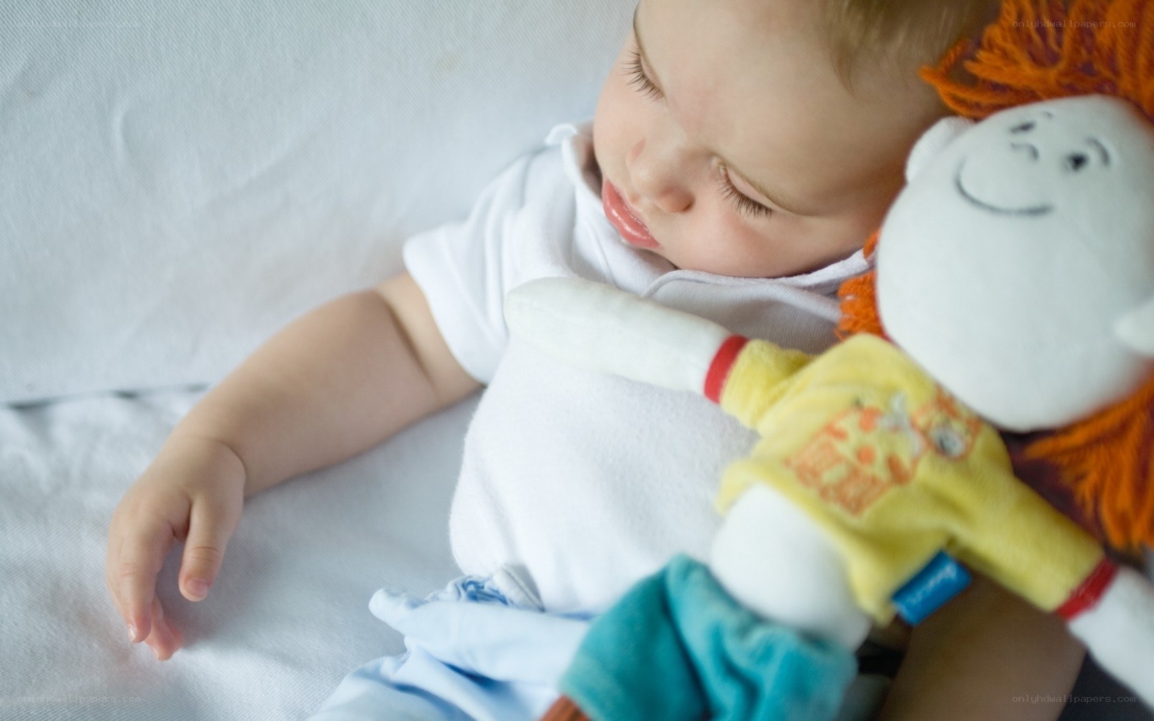 Baby sleeping with toy