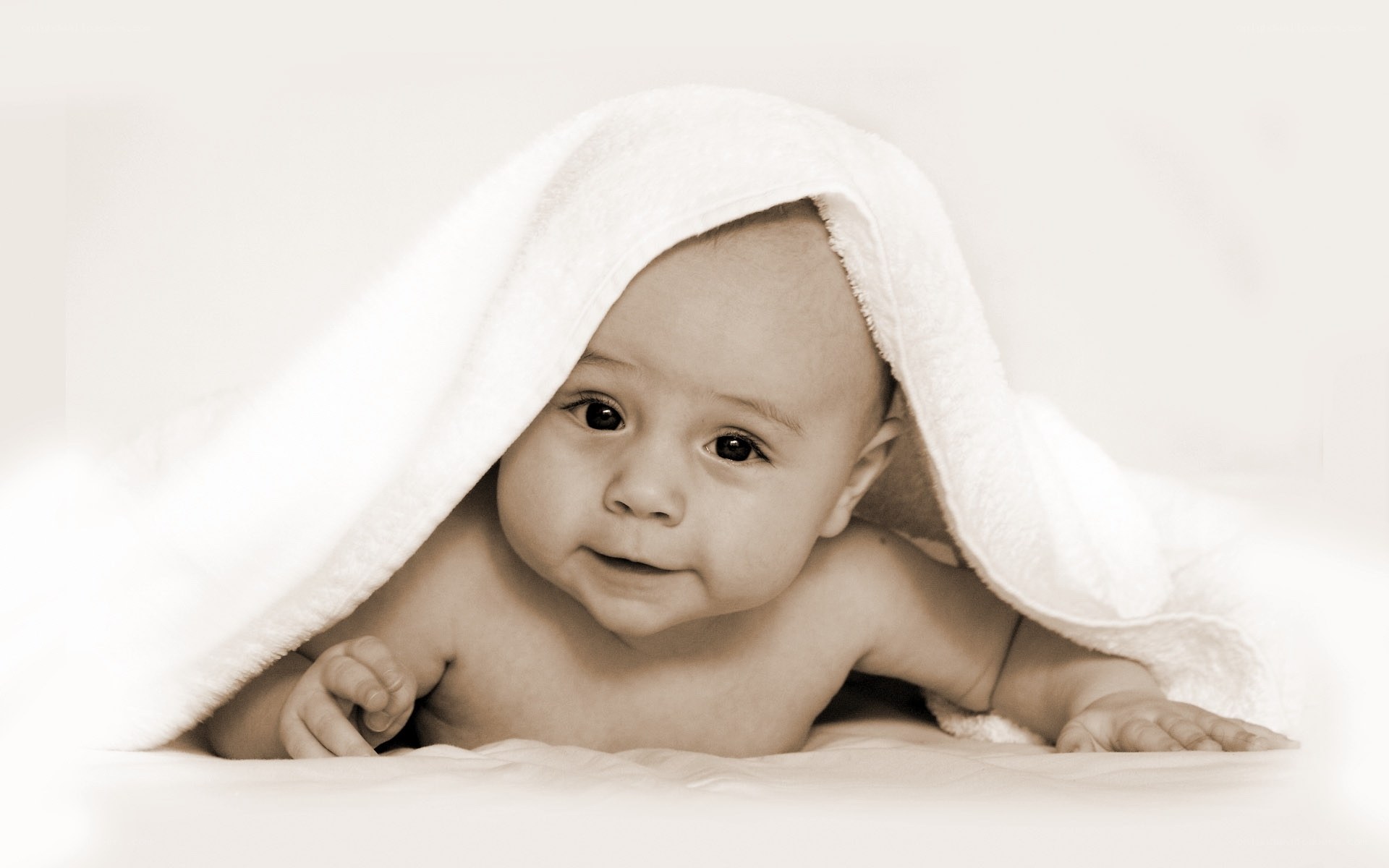 baby under a towel
