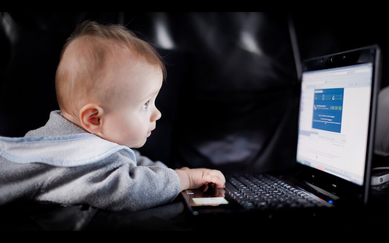 Baby Using Laptop — Black, Focused, Photograph