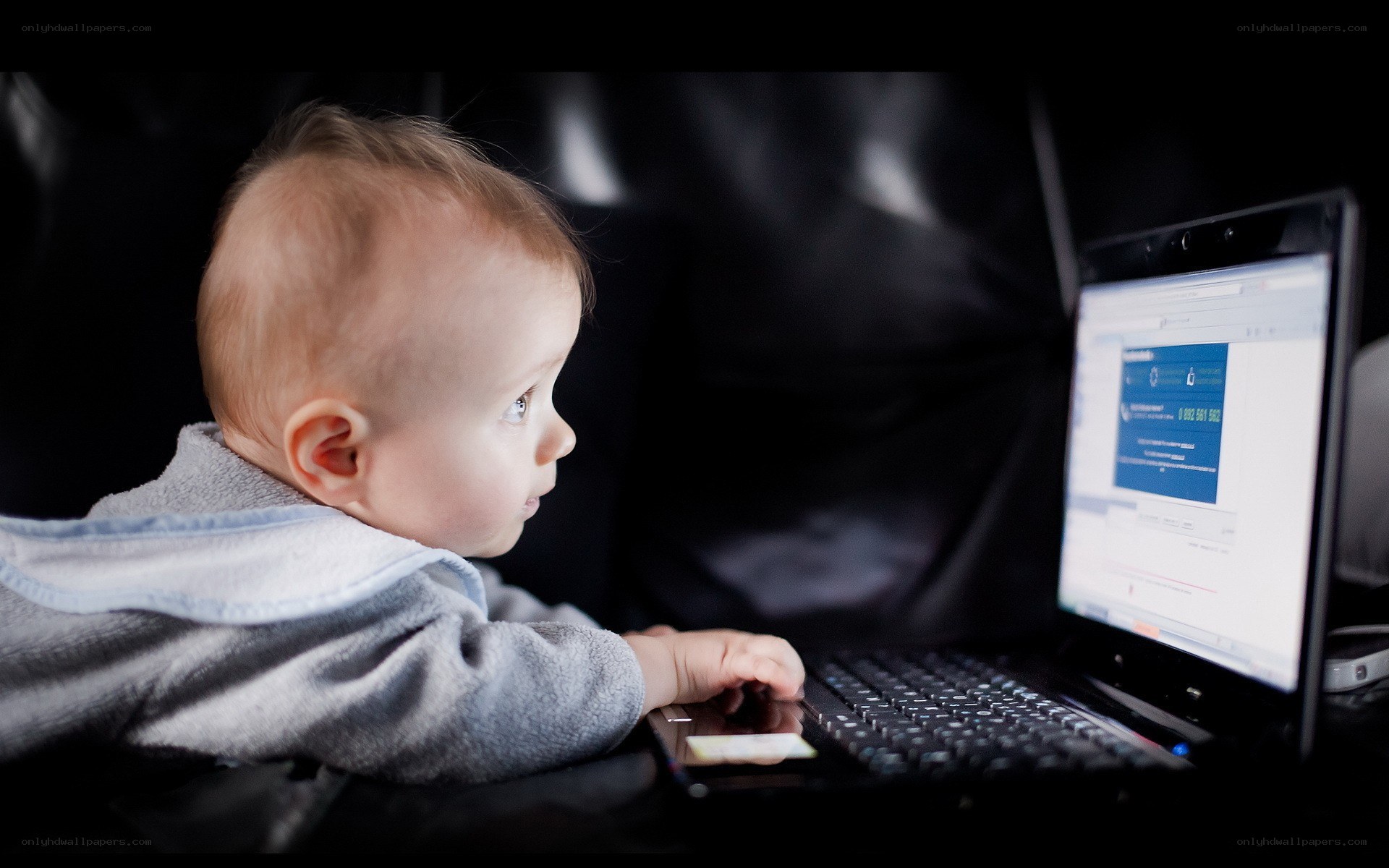 baby using laptop computer