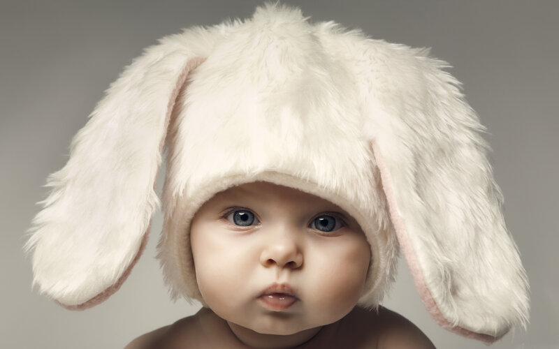 Baby Wearing Bunny Hat — White