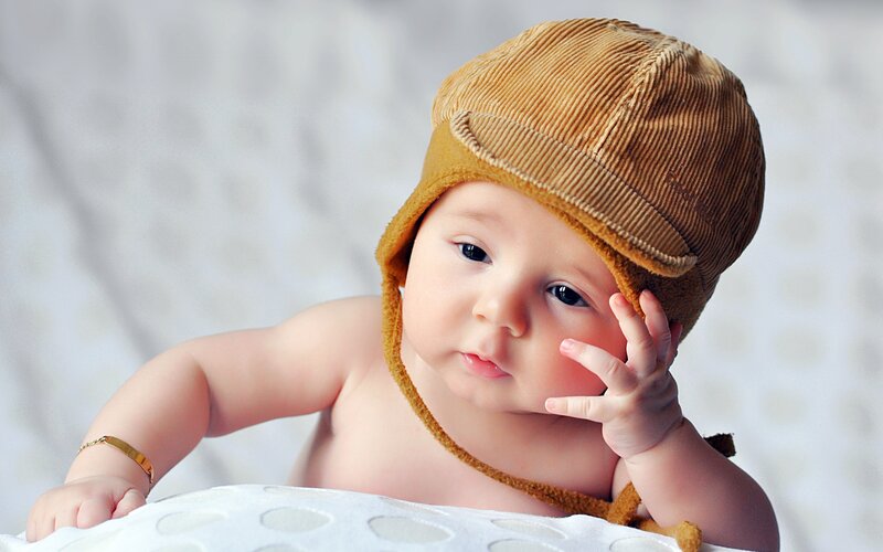Baby Wearing Hat — Brown, Calm, Photograph