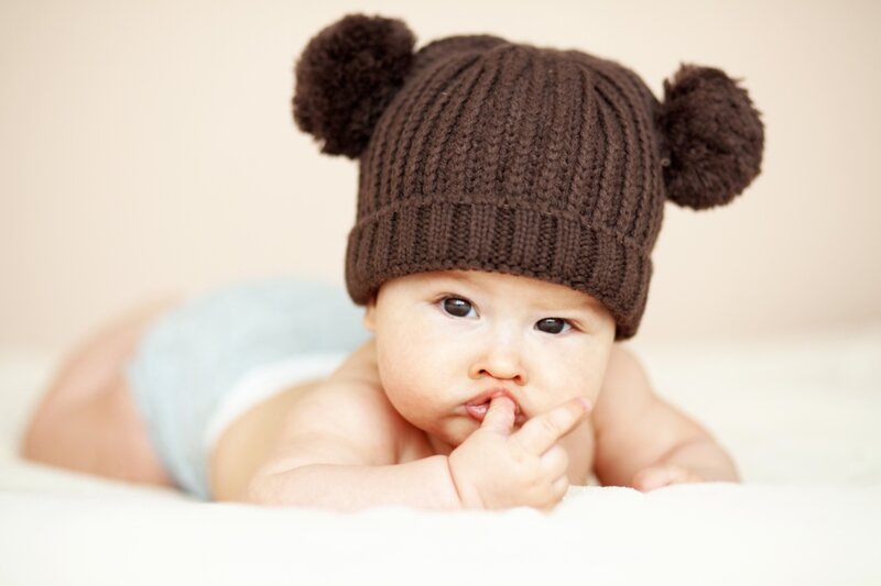 Baby Wearing Hat — Brown