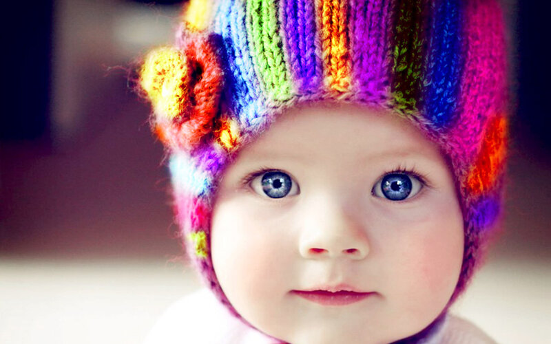 Baby Wearing Hat — Rainbow, Innocent