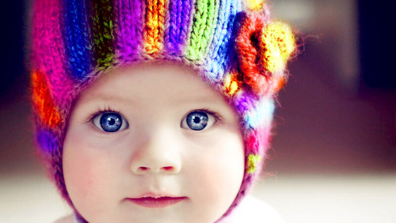 Baby Wearing Hat — Rainbow
