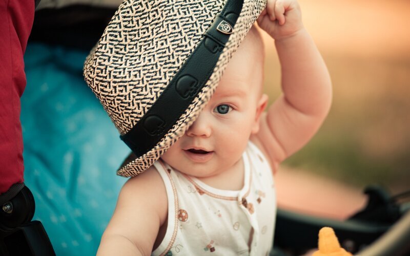 Baby Wearing Hat — White, Calm, Sunset, Photograph, Stroller