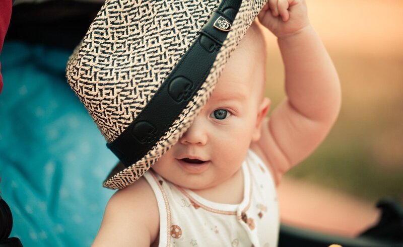Baby Wearing Hat — White, Calm, Sunset, Photograph