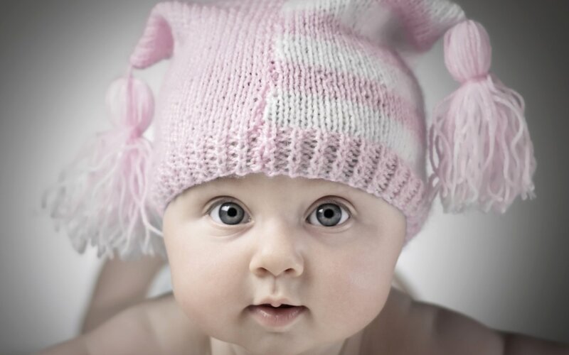 Baby Wearing Knitted Hat — Pink, Innocent