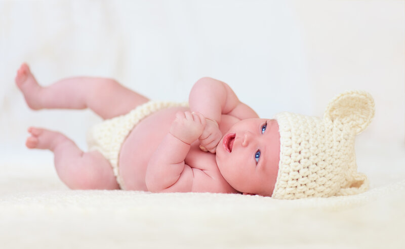 Baby Wearing Knitted Hat — White, Calm