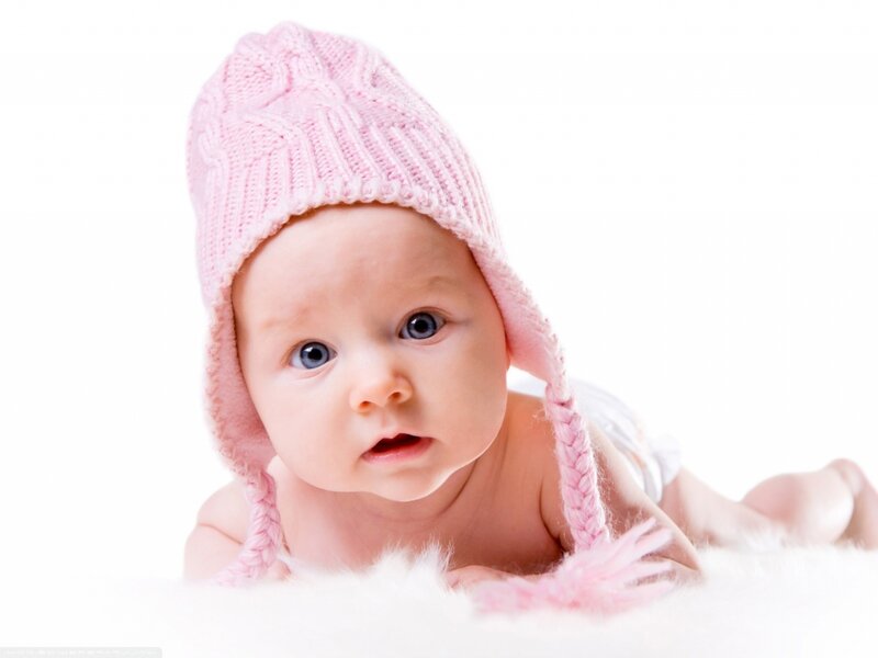 Baby Wearing Pink Hat — Innocent