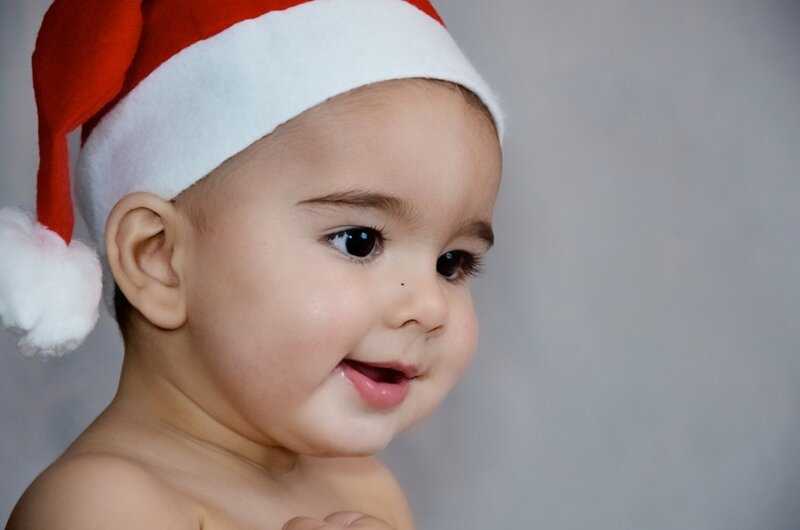 Baby Wearing Santa Hat — Red, Cheerful