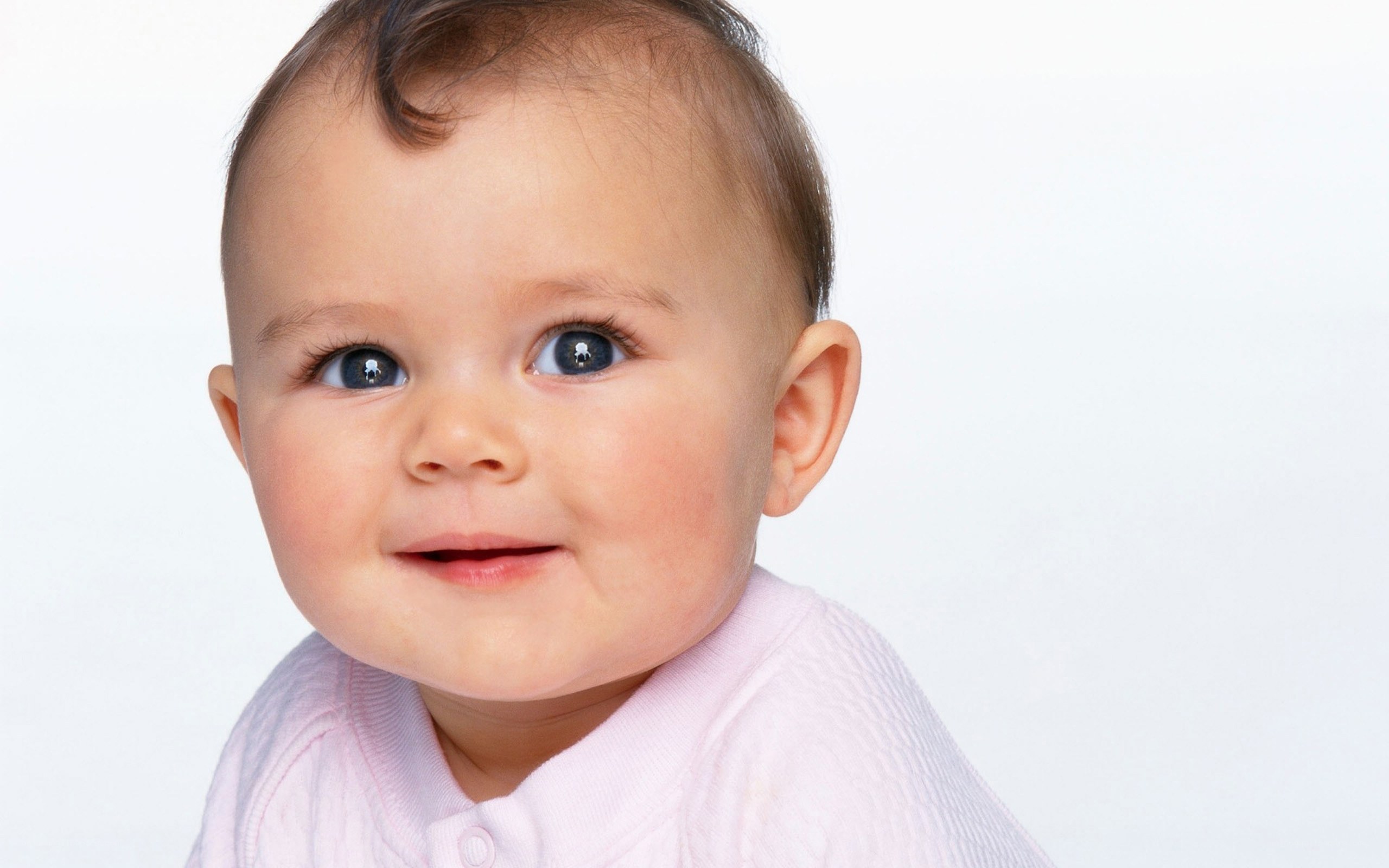 baby with blue eyes smiling