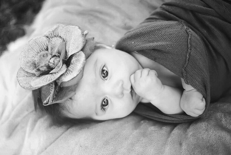 Baby with Flower Headband — Black, Calm
