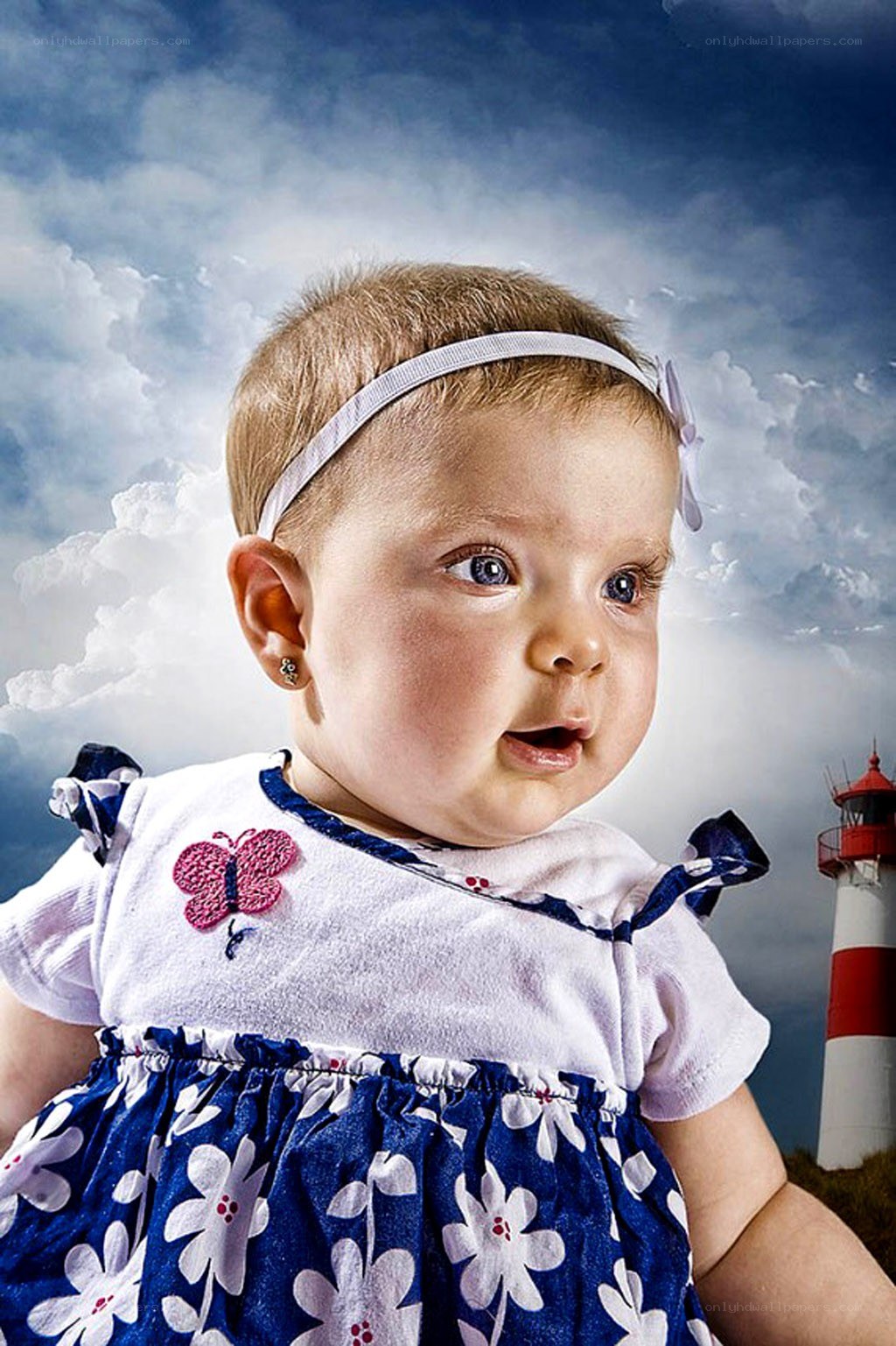 Baby with lighthouse background