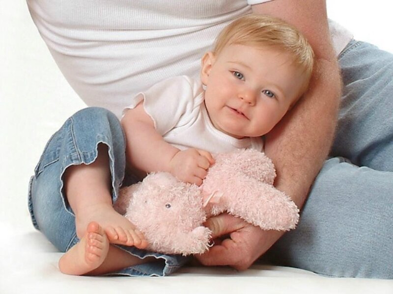 Baby with pink stuffed animal