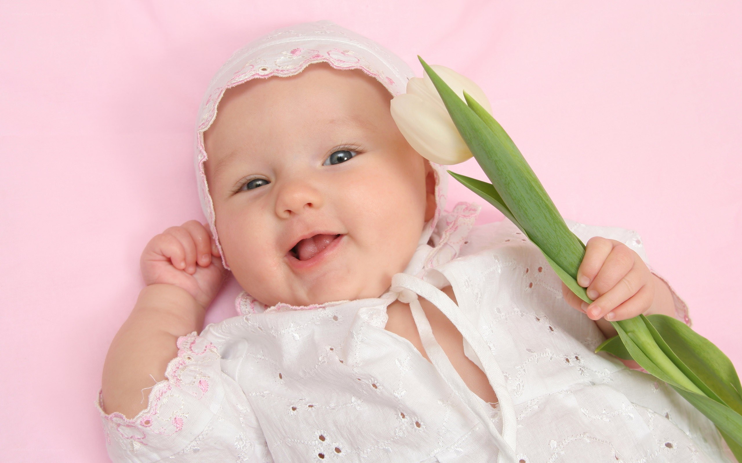 Baby with white tulip