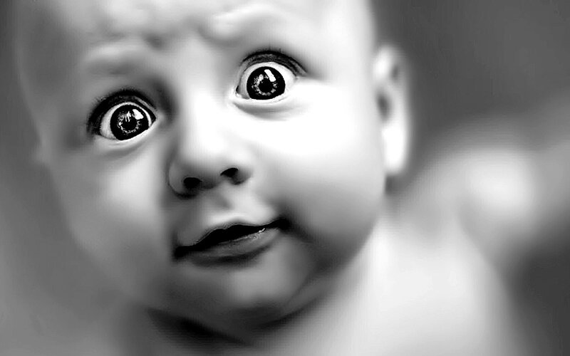 baby with wide eyes