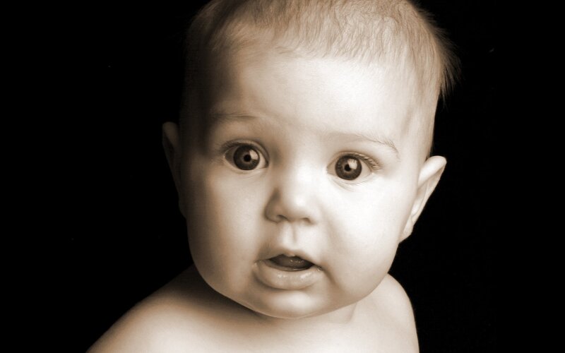 baby with wide eyes