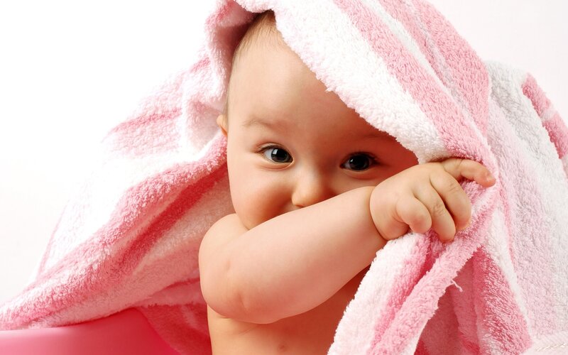 baby wrapped in towel