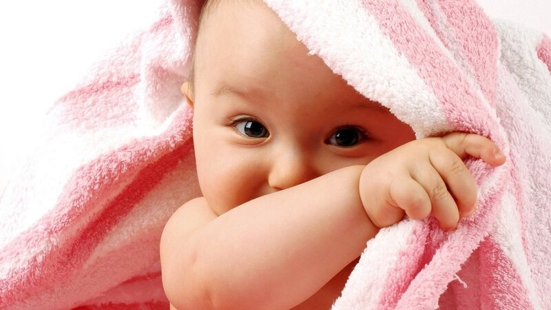 baby wrapped in towel
