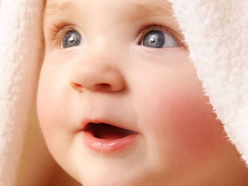 baby wrapped in towel