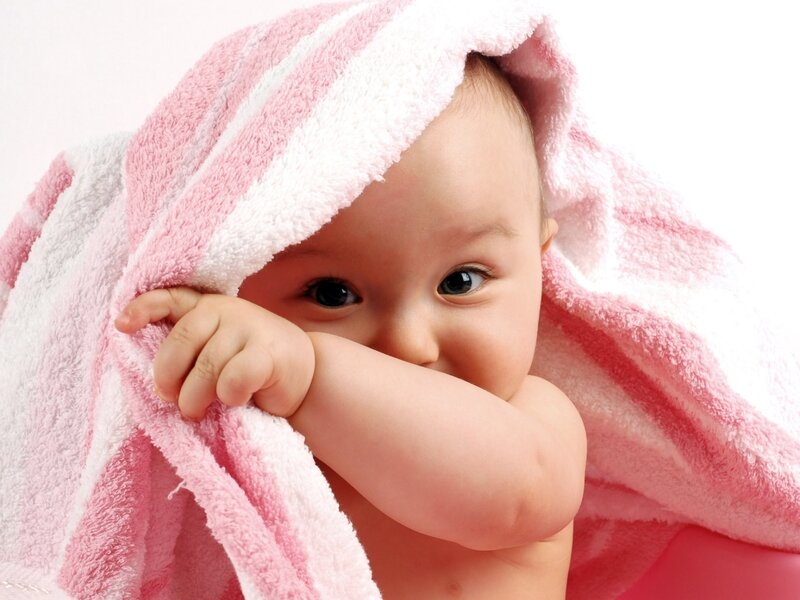 baby wrapped in towel