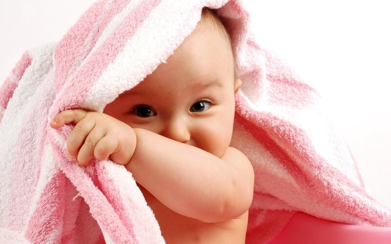 baby wrapped in towel