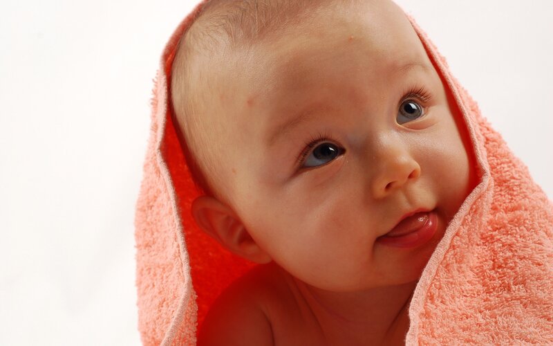 baby wrapped in towel